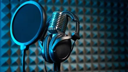 Podcast microphone on dark background